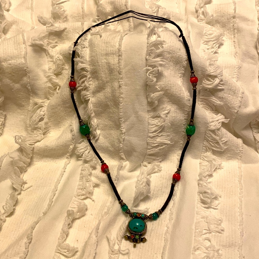 Artisan turquoise beaded Boho necklace on a leather strap.